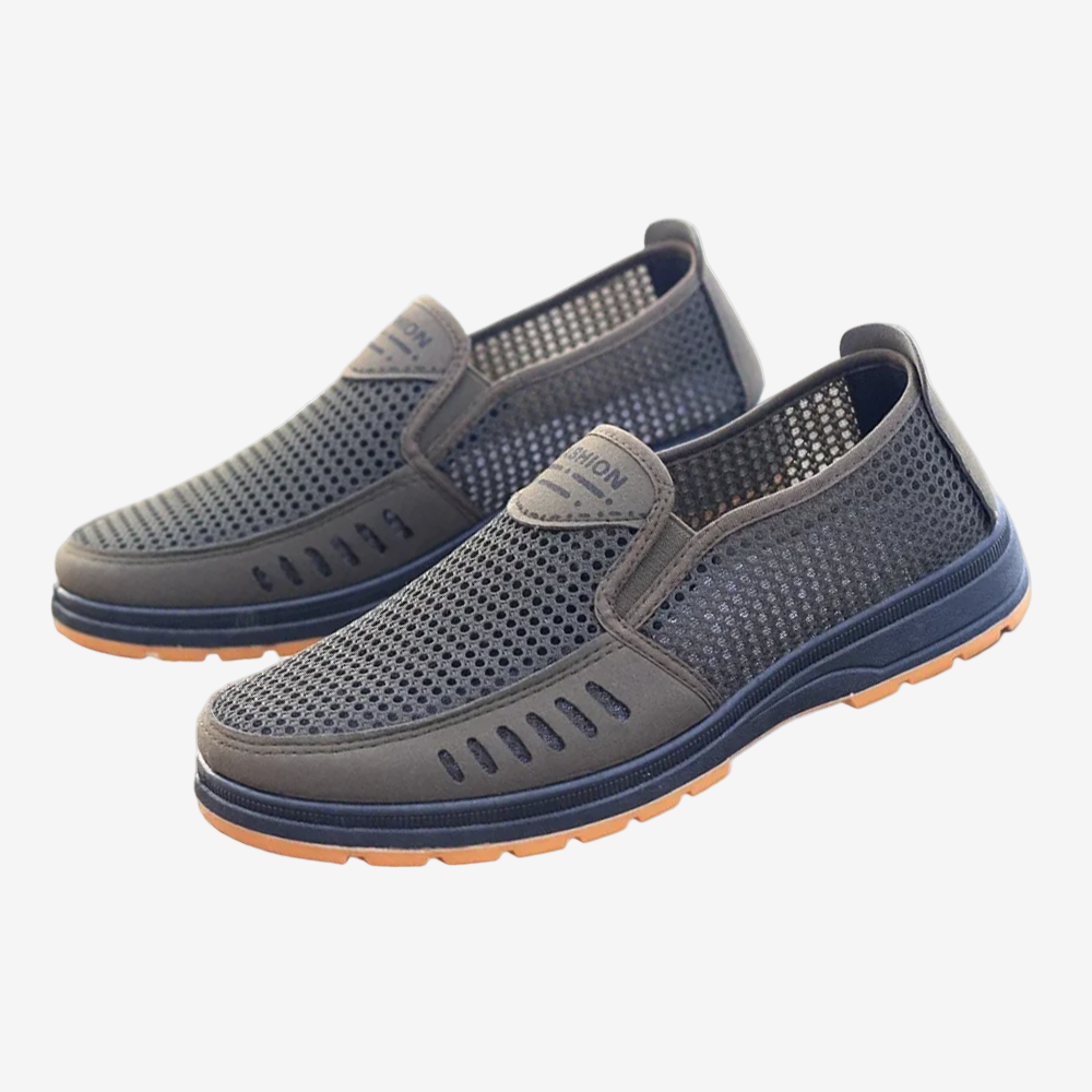 A pair of blue orthopedic shoes for men with a non-slip sole and breathable mesh upper.